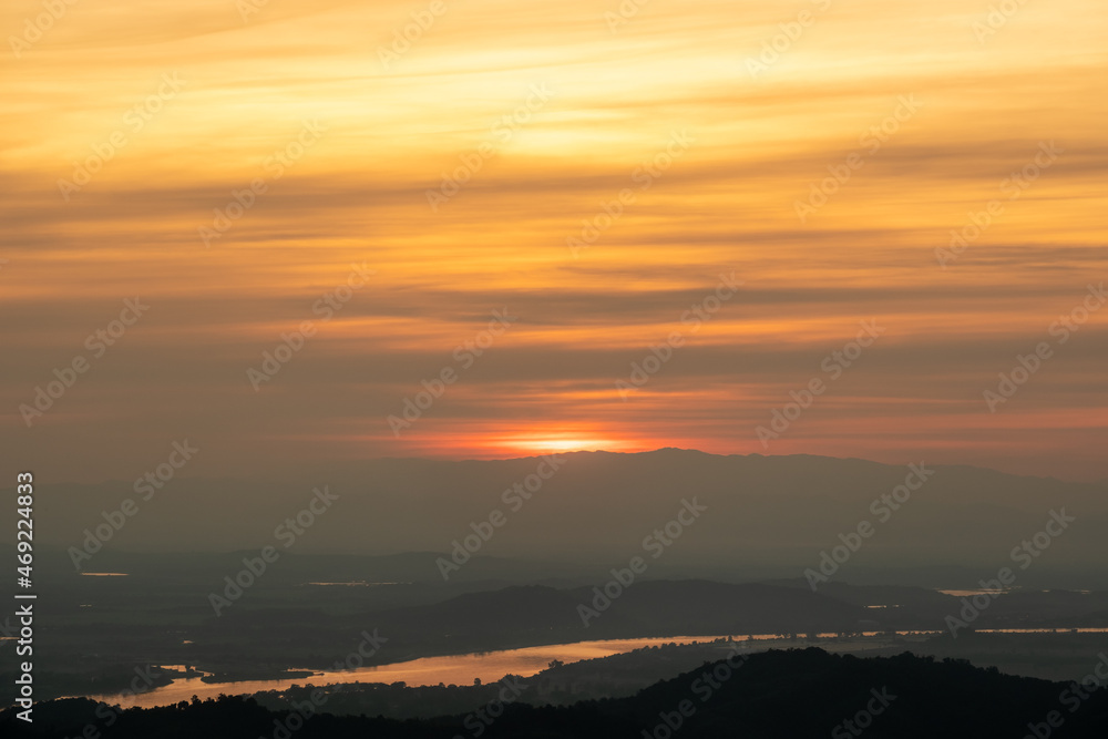 Wall mural aerial view of endless lush pastures of chiangrai. landscape on sunset.the sun's reflection on the r
