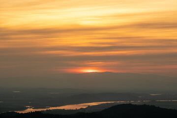 Aerial view of endless lush pastures of CHIANGRAI. landscape on sunset.The sun's reflection on the river.
