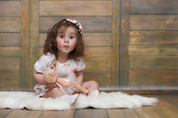 Little girl with curly hair, having fun while posing