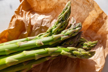 green asparagus on a brown bag