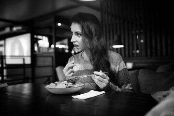 Girl in a cafe at a dinner