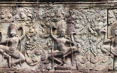 Fototapeta na wymiar Wall carving with dancer apsara, Angkor Wat, Siem Reap, Cambodia