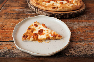 Homemade barbecue chicken pizza with onion and special sauce. Pizza with ingredients to cook it. Delicious Italian food