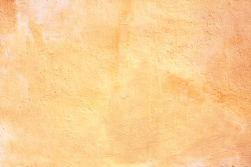 Old stucco wall texture of yellow color