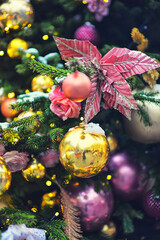 Fototapeta na wymiar Beautiful New Year decorations on the Christmas tree. Christmas decorations