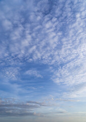 Fototapeta premium Beautiful view of sky with clouds at sunrise. Partly cloudy. Colorful sunset. Natural sky background texture, beautiful color.