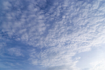 Obraz premium Beautiful view of sky with clouds at sunrise. Partly cloudy. Colorful sunset. Natural sky background texture, beautiful color.