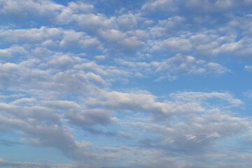 Obraz premium Beautiful view of sky with clouds at sunrise. Partly cloudy. Colorful sunset. Natural sky background texture, beautiful color.