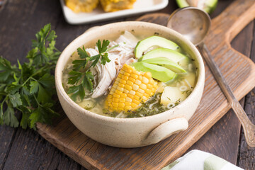 Traditional Ajiaco Colombiano - Colombian Soup with potato, chicken, avocado
