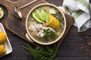 Traditional Ajiaco Colombiano - Colombian Soup with potato, chicken, avocado