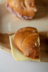 Tasty bread sandwiches on a shelf close up still catering food