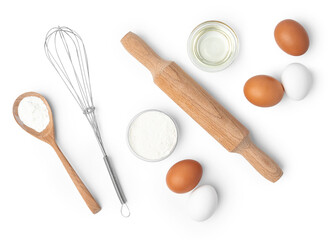 Metal whisk and eggs for cooking isolated on white