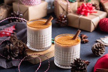 Traditional Christmas drink and dessert Eggnog with handmade gift boxes