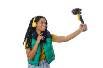 Female blogger recording a video with smartphone while creating content for social media networks.