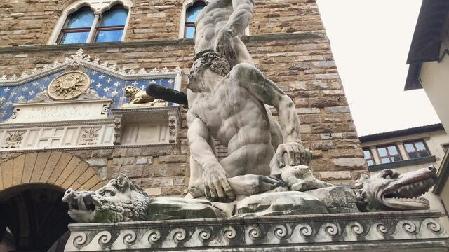 Tilt up shot of Hercules and Cacus sculpture in Piazza della Signoria, Florence, Tuscany, Italy, slow motion