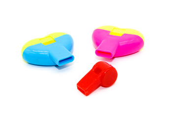 Toy Whistle on white background with selective focus