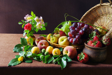 Classic still life with fruits, grapes and flowers. Assortment of delicious fruits. 