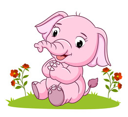 The pretty elephant is sitting on the grass