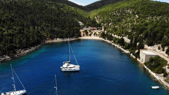 Cruise Ships At Foki Beach Foki Beach Surrounded With Forested Hills And Rocky Outcrop In Kefalonia, Greece. aerial