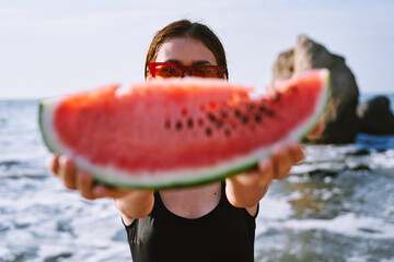 cheerful pretty woman in black swimsuit watermelon fashion travel