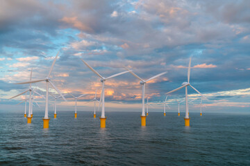 Offshore wind farm at beautiful, dramatic sunset