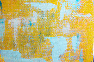 creative background, a spot of  colored primer rubbed on the surface of a linen canvas, temporary...