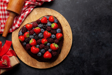 Heart shaped sweet cake with berries