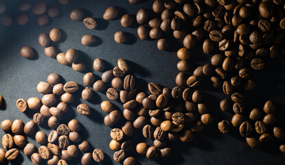 Flying coffee beans over dark