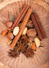 Traditional Christmas spices - Star anise with cinnamon and cloves on dark rustic wooden background