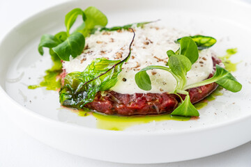 beef tartare with sauce and herbs
