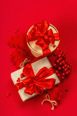 Gift concept in red colors. New Year or Christmas, festive mood