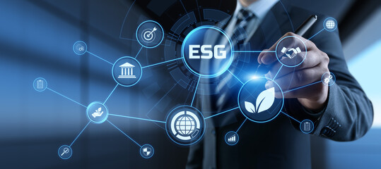 ESG environmental social governance business strategy investing concept. Businessman pressing button on screen.