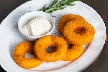 cheese rings with cheese sauce with spices