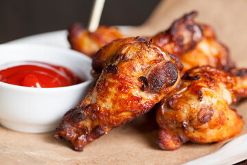 baked chicken wings together with ketchup