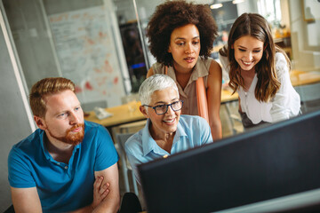 Group of happy multiethnic success business people working and brainstorming in corporate office