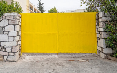 vivid yellow painted metallic garage door