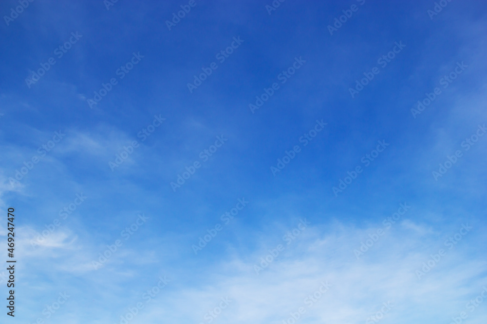 Wall mural blue sky background and white clouds soft focus, and copy space horizontal shape.