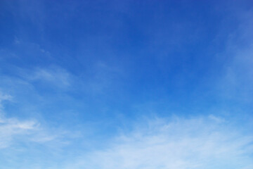 Blue sky background and white clouds soft focus, and copy space horizontal shape.