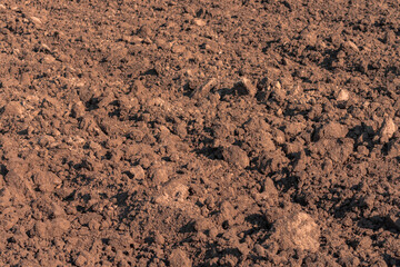 Plowed ground of farm field as background