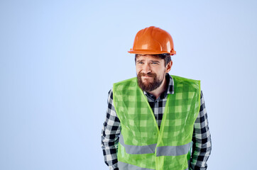 bearded man in working uniform construction building profession blue background