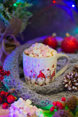 Enchanting festive ambiance with a decorative mug full of marshmallows, nestled among bright berries, pinecones, and a soft knitted blanket, illuminated by gentle lights.