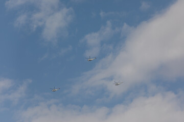 planes and helicopters crossing the sky during a military parade in Madrid
