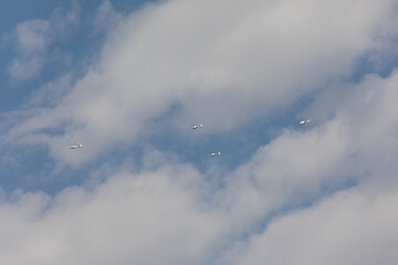 Fototapeta na wymiar planes and helicopters crossing the sky during a military parade in Madrid