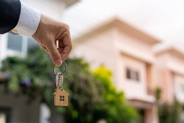 Home buyers are taking home keys from sellers. Deal contract complete. Sell your house, rent house...