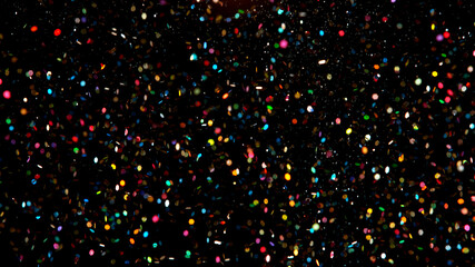 Abstract color particles on black background, close-up.