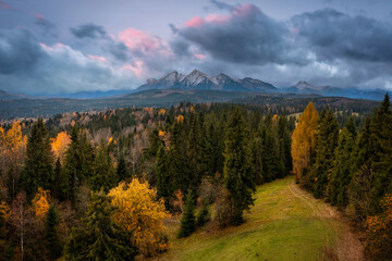 A cloudy sunrise over the autumnal Tatra Mountains. The pass over Lapszanka in Poland.