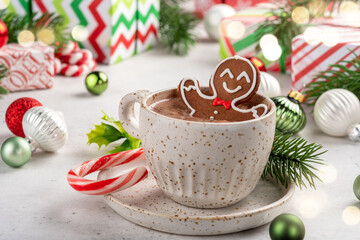 Gingerbread cookie man in a cup of hot chocolate. Happy celebration. Christmas design.