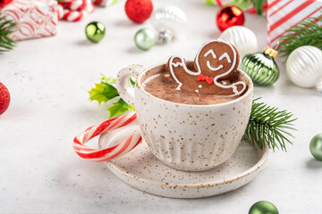 Gingerbread cookie man in a cup of hot chocolate. Happy celebration. Christmas design.