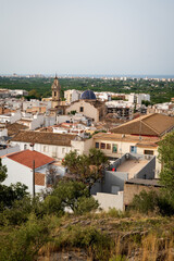 Obraz premium Roof view on old city of Oliva with the church tower of 'Santa Maria la Mayor' reaching out, Spain