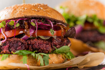 Home made Veggie beet burgers on wooden table, close-up.